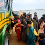 Residents evacuate from a coastal area of Keti Bandar before the expected arrival of Cyclone Biparjoy in Pakistan's Sindh province on June 13.