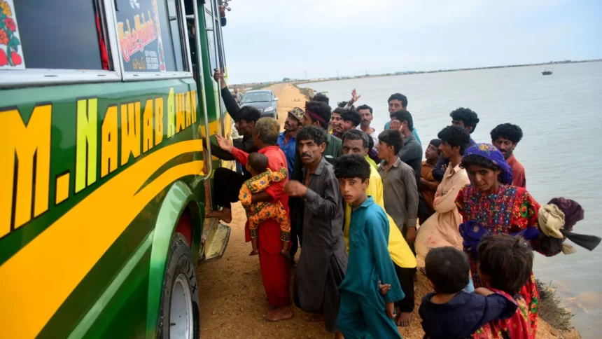 Residents evacuate from a coastal area of Keti Bandar before the expected arrival of Cyclone Biparjoy in Pakistan's Sindh province on June 13.